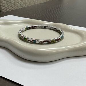 Bangle bracelet with flowers and designs